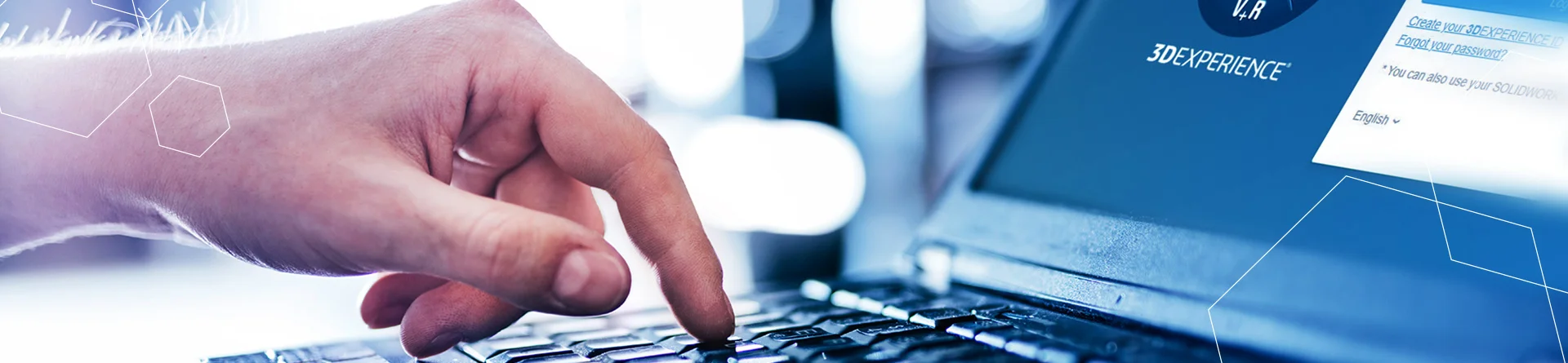 a finger taps on the return key of a laptop to log in to the 3dexperience platform.
